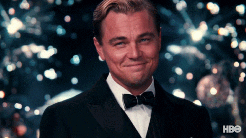 GIF of Leonardo DiCaprio Wolf of Wall Street doing "cheers"